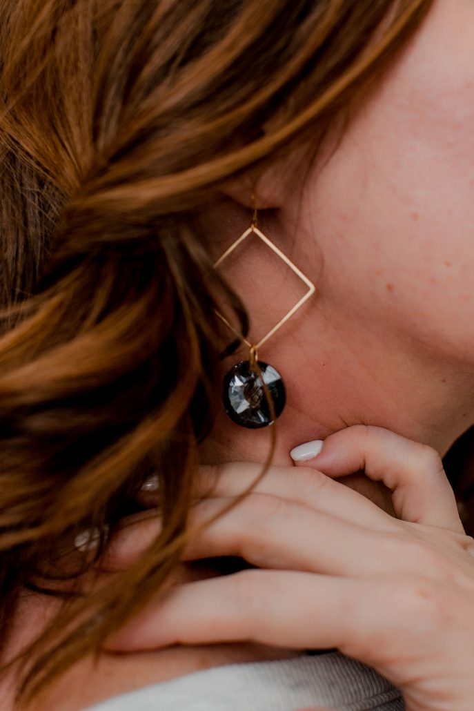 Woman Models Black & Gold Earring For Frock Asheville NC