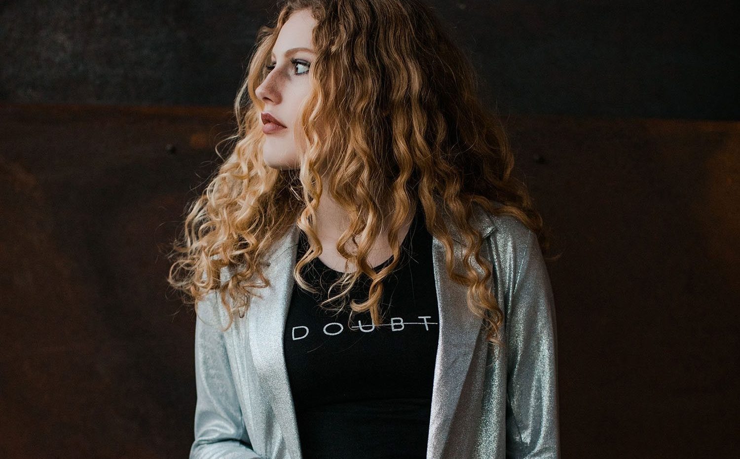 Woman Models Black Shirt and Gray Blazer For Frock Boutique Asheville NC